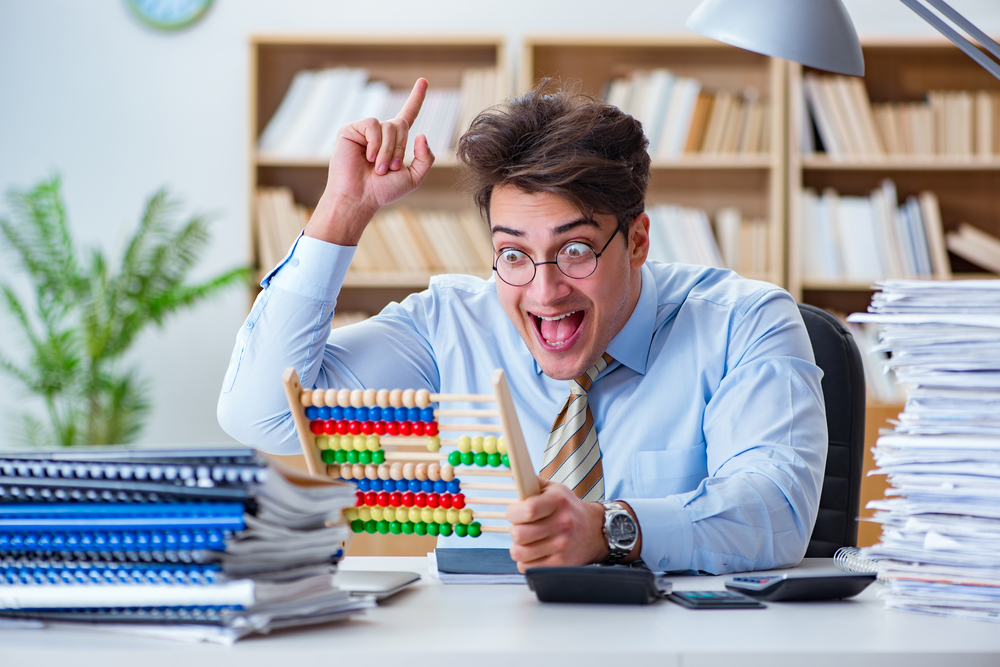 Accounting nerd looking excitedly at an abacus